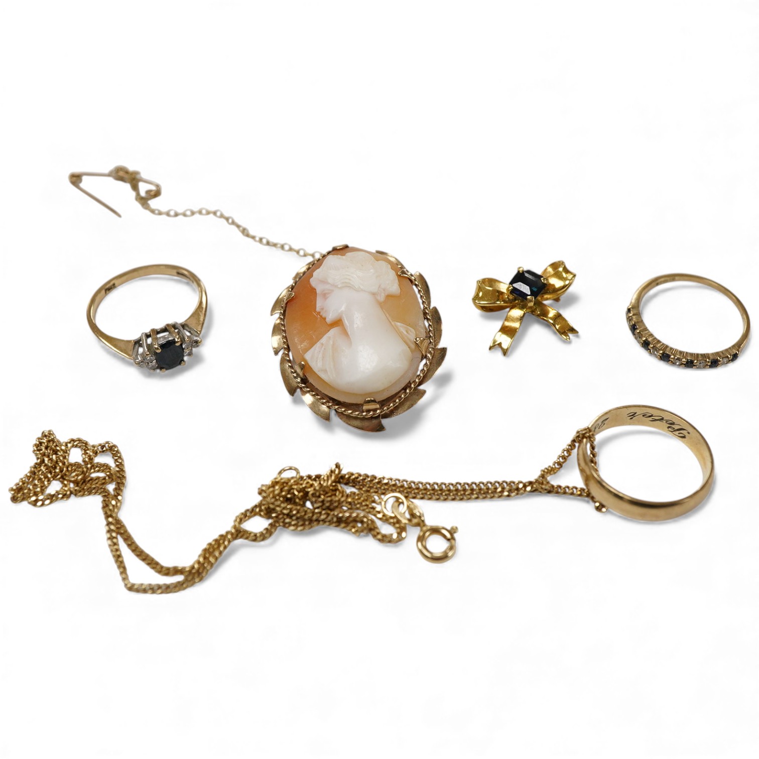 A collection of jewels, including a shell cameo pendant, length 3cm; a chain, length 45.5cm; two sapphire and diamond rings, each size H; and a wedding band, size J, each with British hallmarks for 9ct gold, combined gro